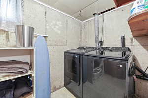 Laundry area featuring separate washer and dryer
