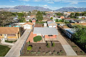 Aerial perspective of suburban area featuring a mountainous background