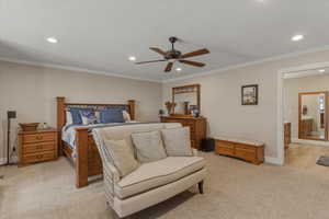 Bedroom featuring ceiling fan, crown molding, recessed lighting, and light carpet