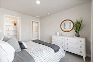 Bedroom featuring dark carpet