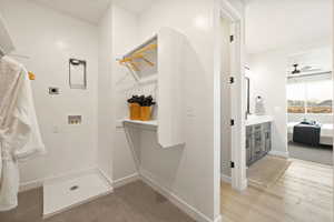 Bathroom with ensuite bath, vanity, and ceiling fan
