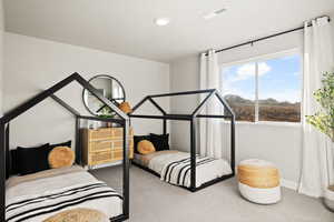 Carpeted bedroom featuring baseboards