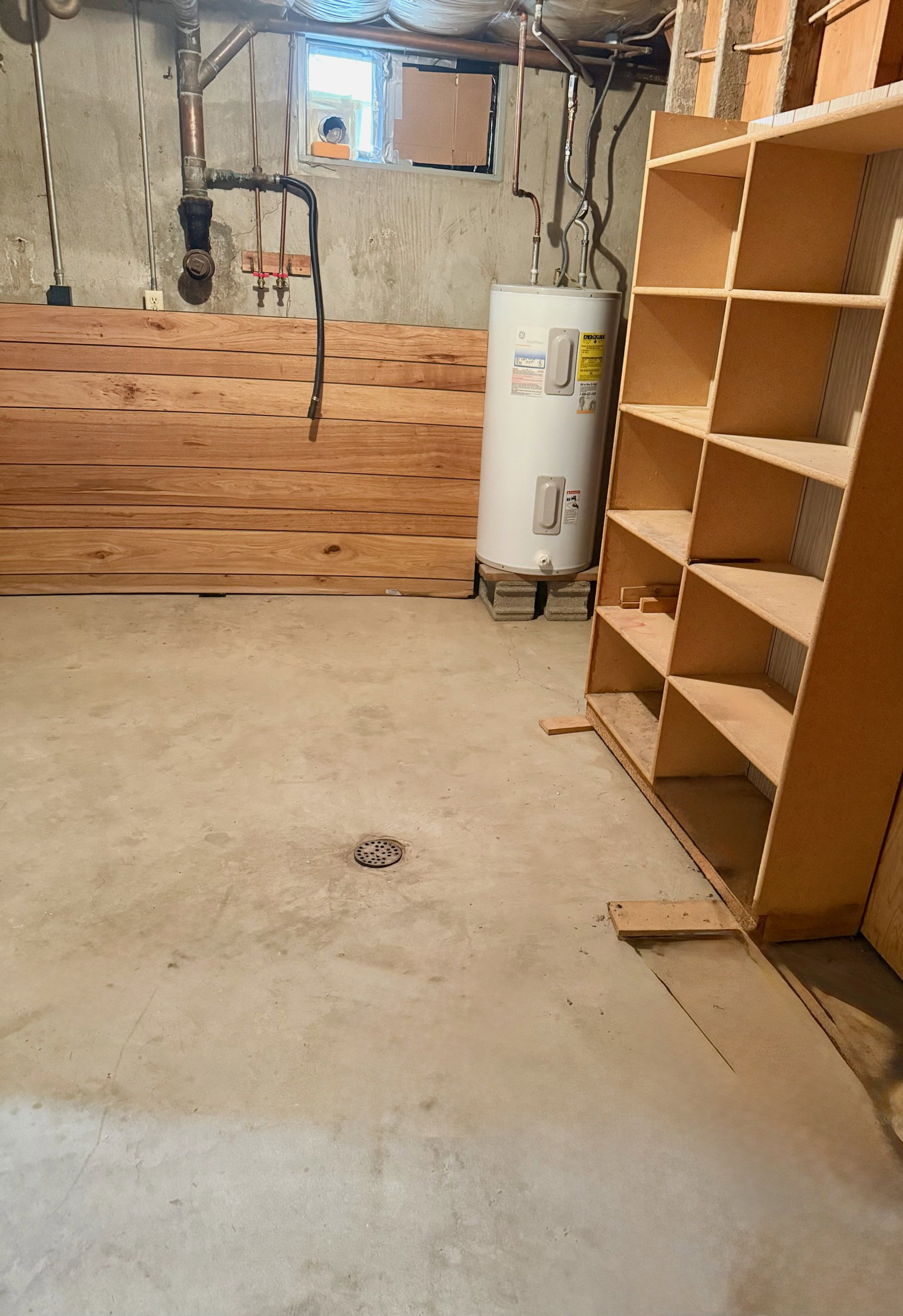 Basement featuring water heater