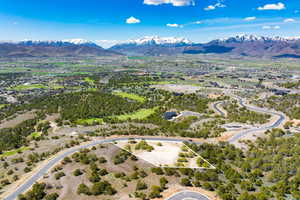 Aerial view of property's location featuring a mountainous background and property boundaries highlighted