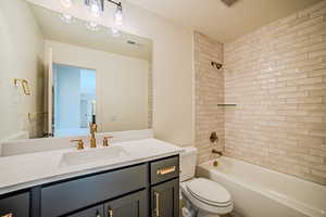 Full bath with vanity and tub / shower combination
