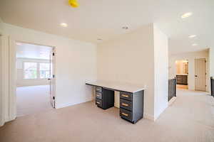Unfurnished office featuring light carpet and recessed lighting