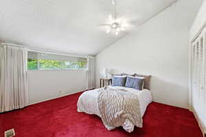 Bedroom featuring carpet floors, ceiling fan, and a closet