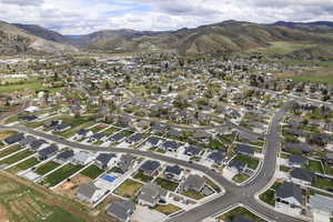 Aerial view of residential area featuring a mountainous background