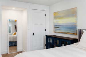 Bedroom featuring carpet floors and baseboards