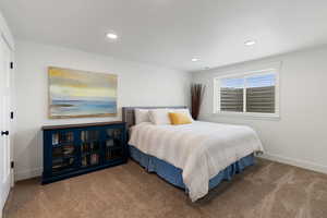 Carpeted bedroom featuring recessed lighting and baseboards