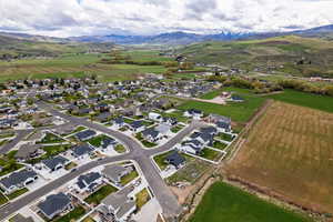 Aerial perspective of suburban area with a mountainous background