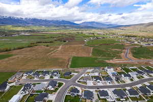 View of rural area featuring mountains and nearby suburban area