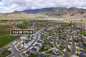 View of property location with a mountainous background, nearby suburban area, and property parcel outlined