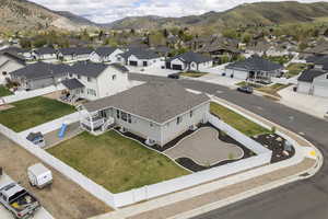 Aerial perspective of suburban area with a mountain backdrop