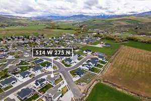 View of property location featuring mountains and nearby suburban area