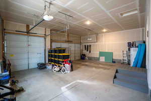 Garage featuring a garage door opener
