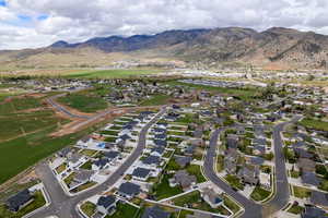 Aerial view of residential area featuring a mountain backdrop