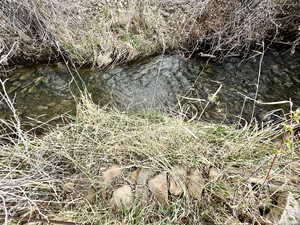 Creek runs on North and East side