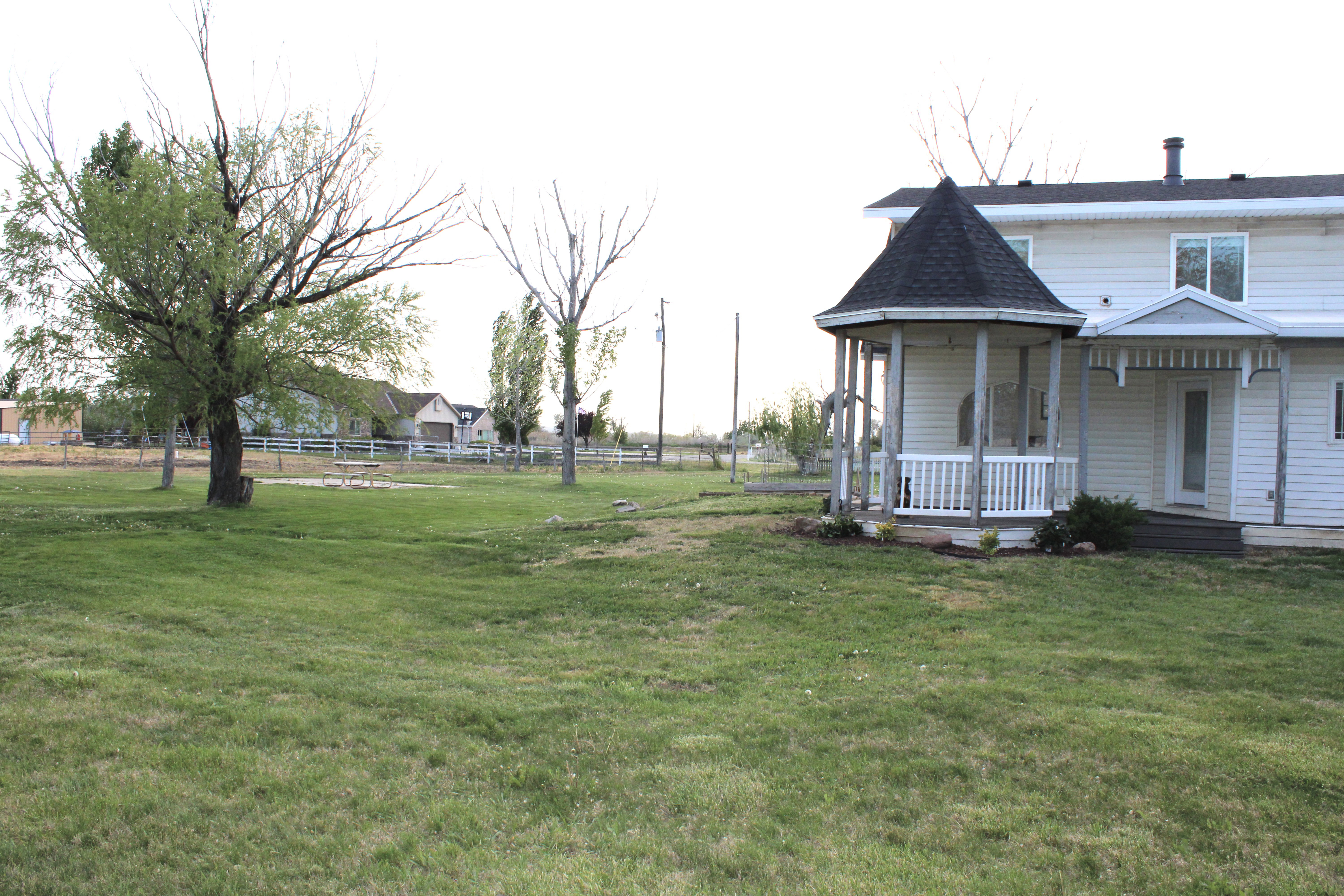 View of yard and covered porch