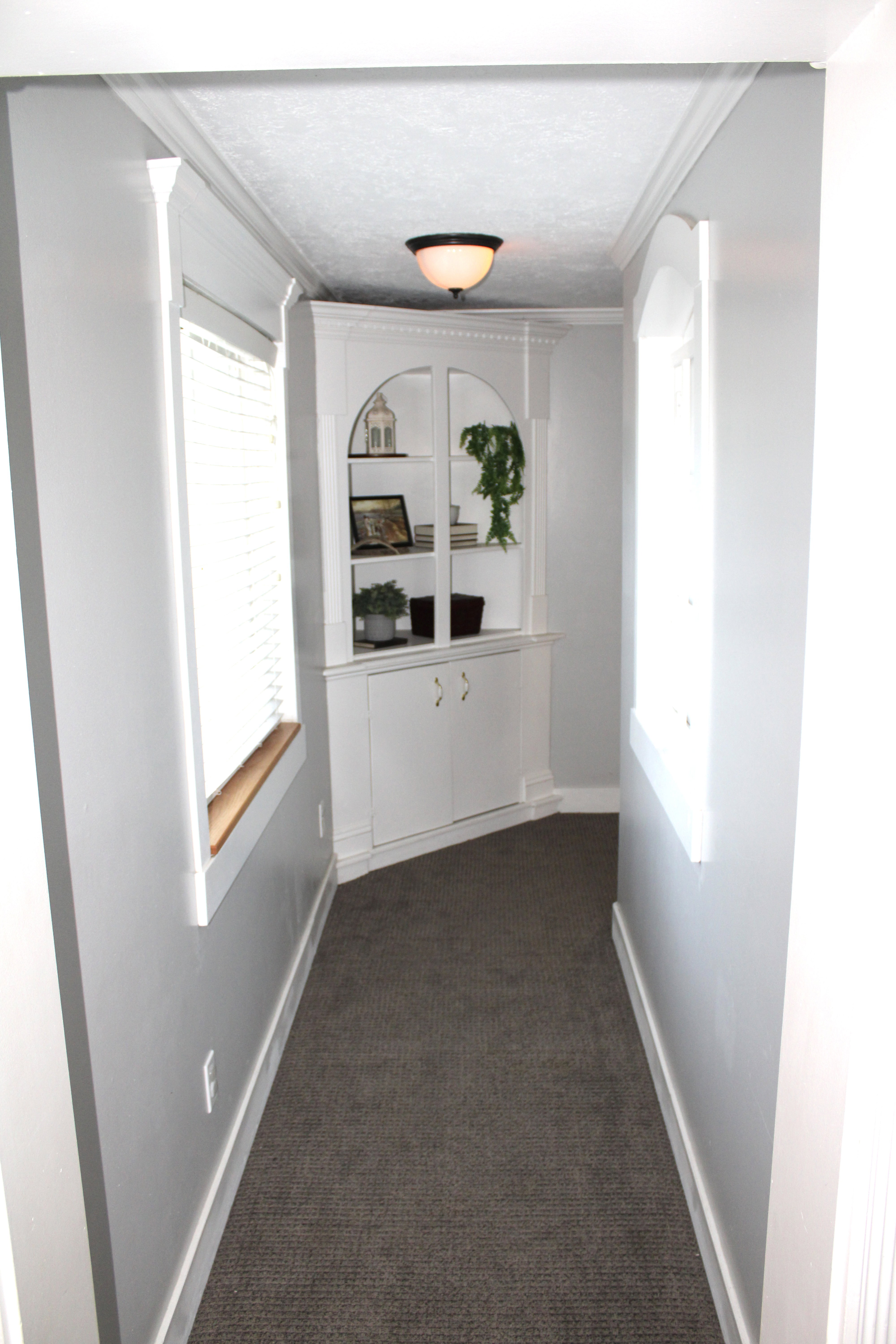 Hall featuring ornamental molding