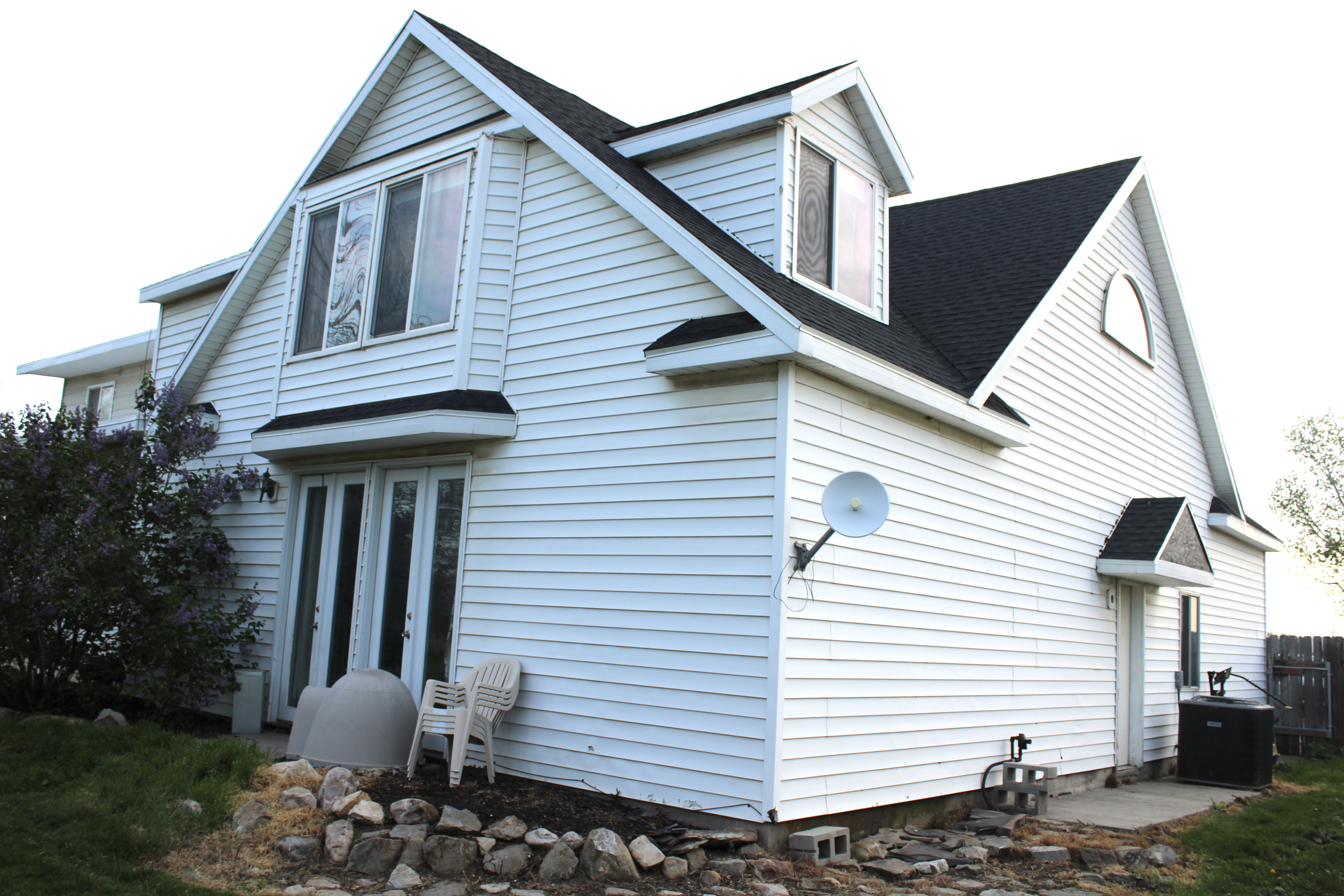 View of side of property with AC unit