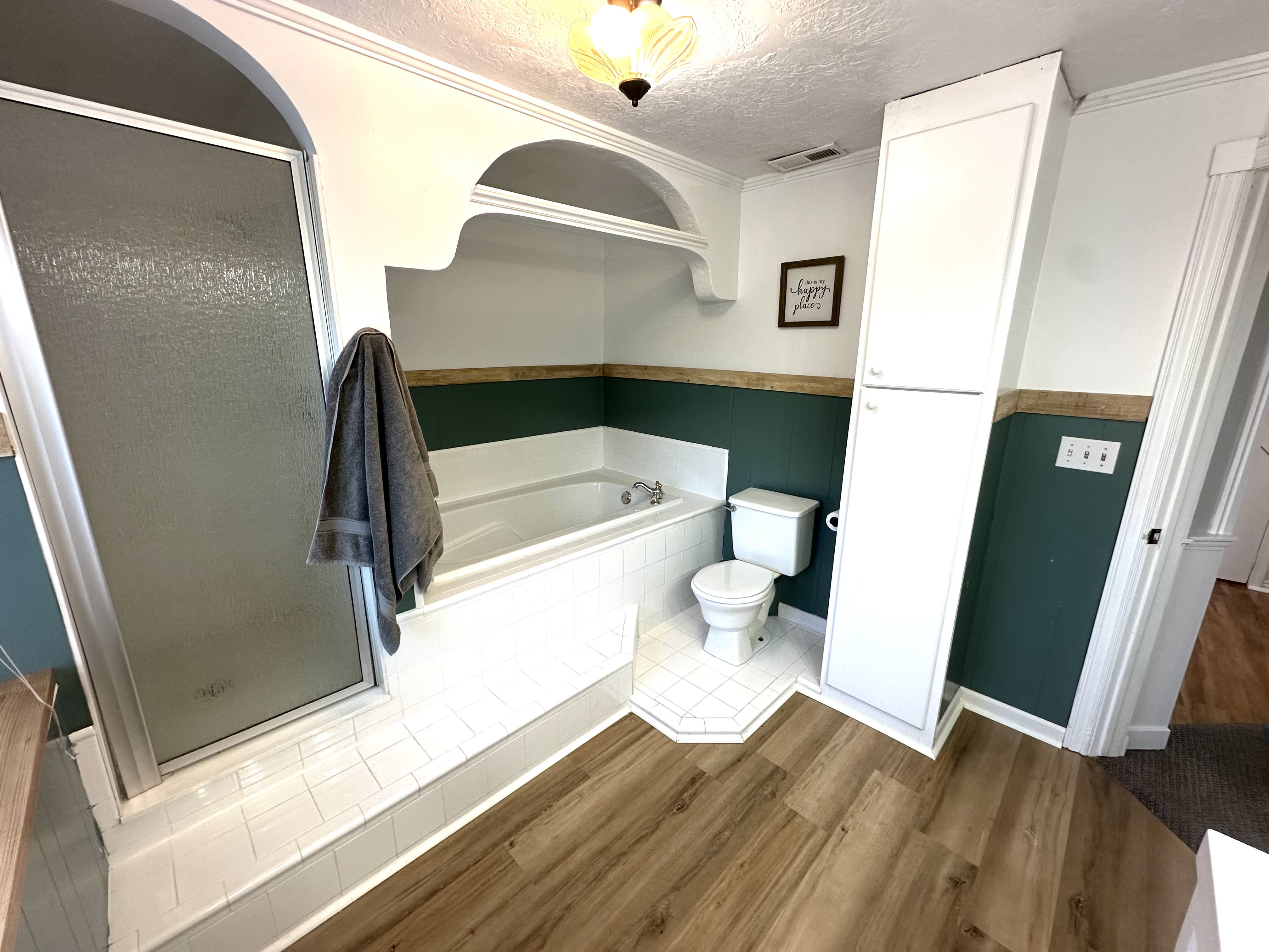 Full bath with a large garden tub