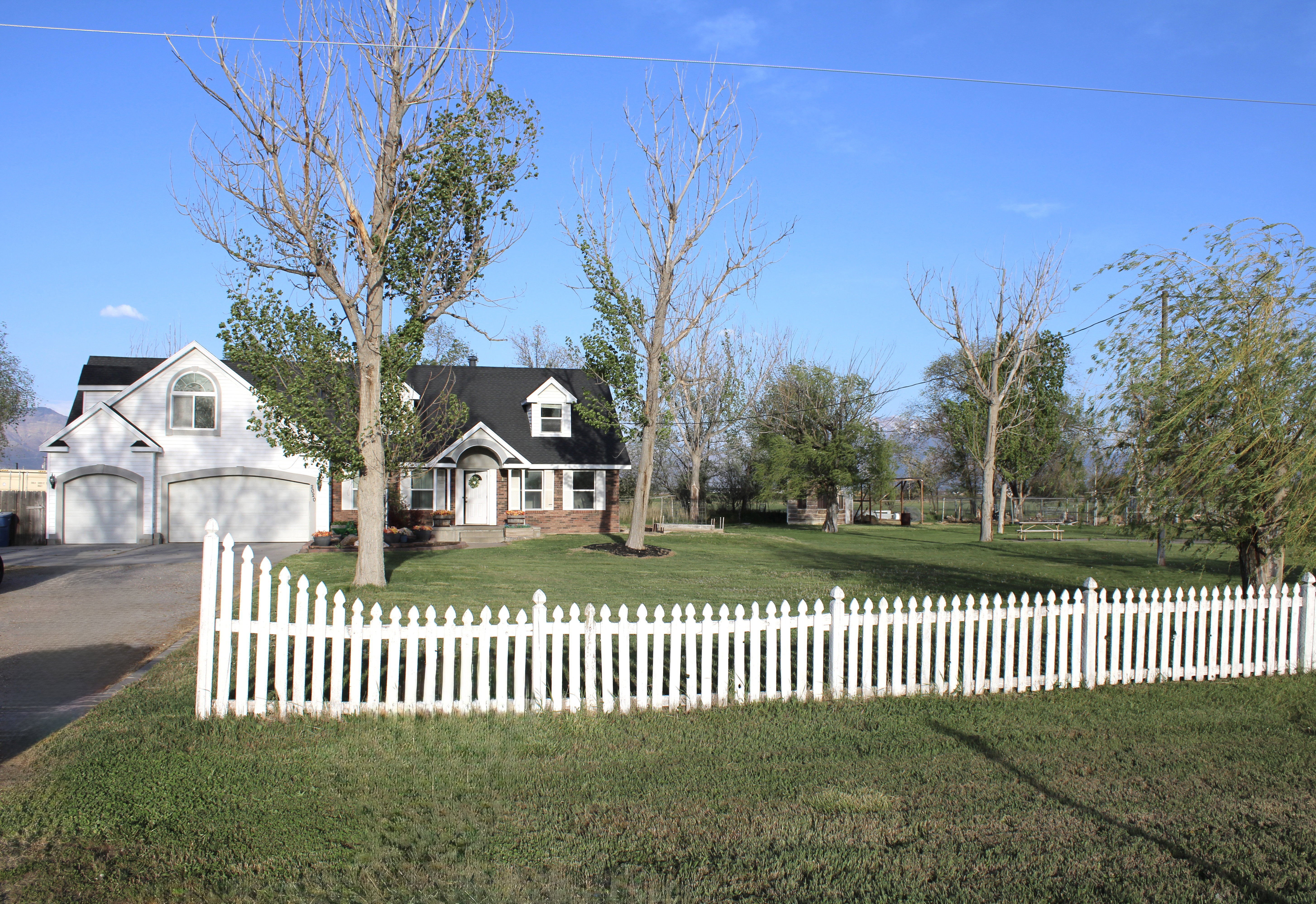 White picket fence and front Yard