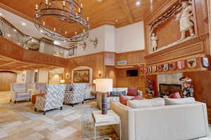 Common area featuring a high wood ceiling and wooden walls