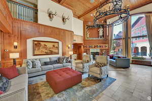 Building lobby featuring a high wood ceiling, wood walls, and recessed lighting