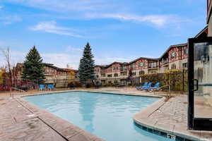 Community pool with a patio area