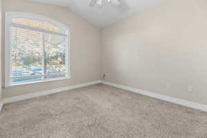 Bedroom 3 with light carpet, vaulted ceiling, and ceiling fan