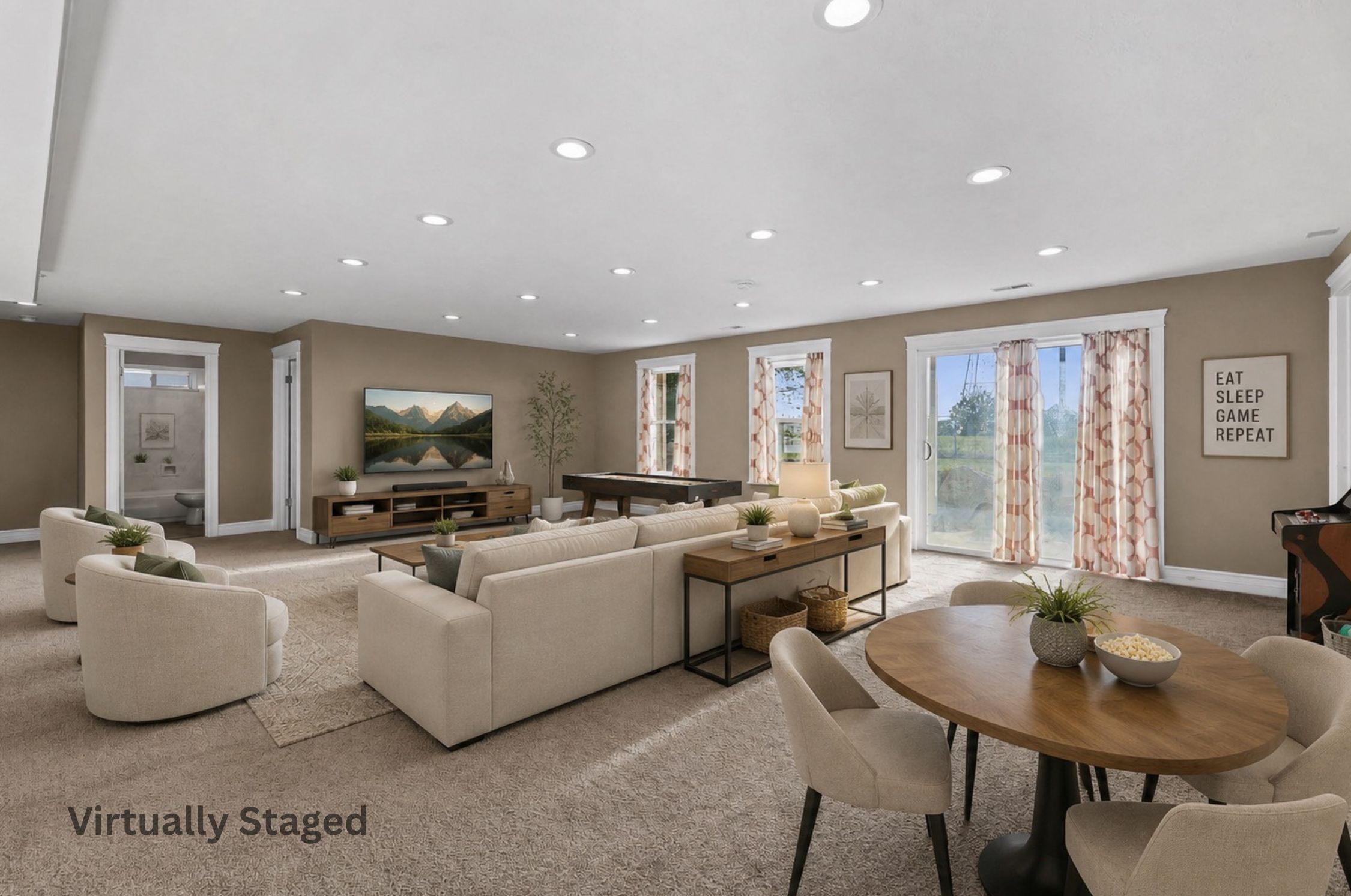 Spacious entertainment room featuring recessed lighting, plush carpeting, multiple windows with white trim, and a sliding glass door providing external access. Walk out basement. Virtually staged