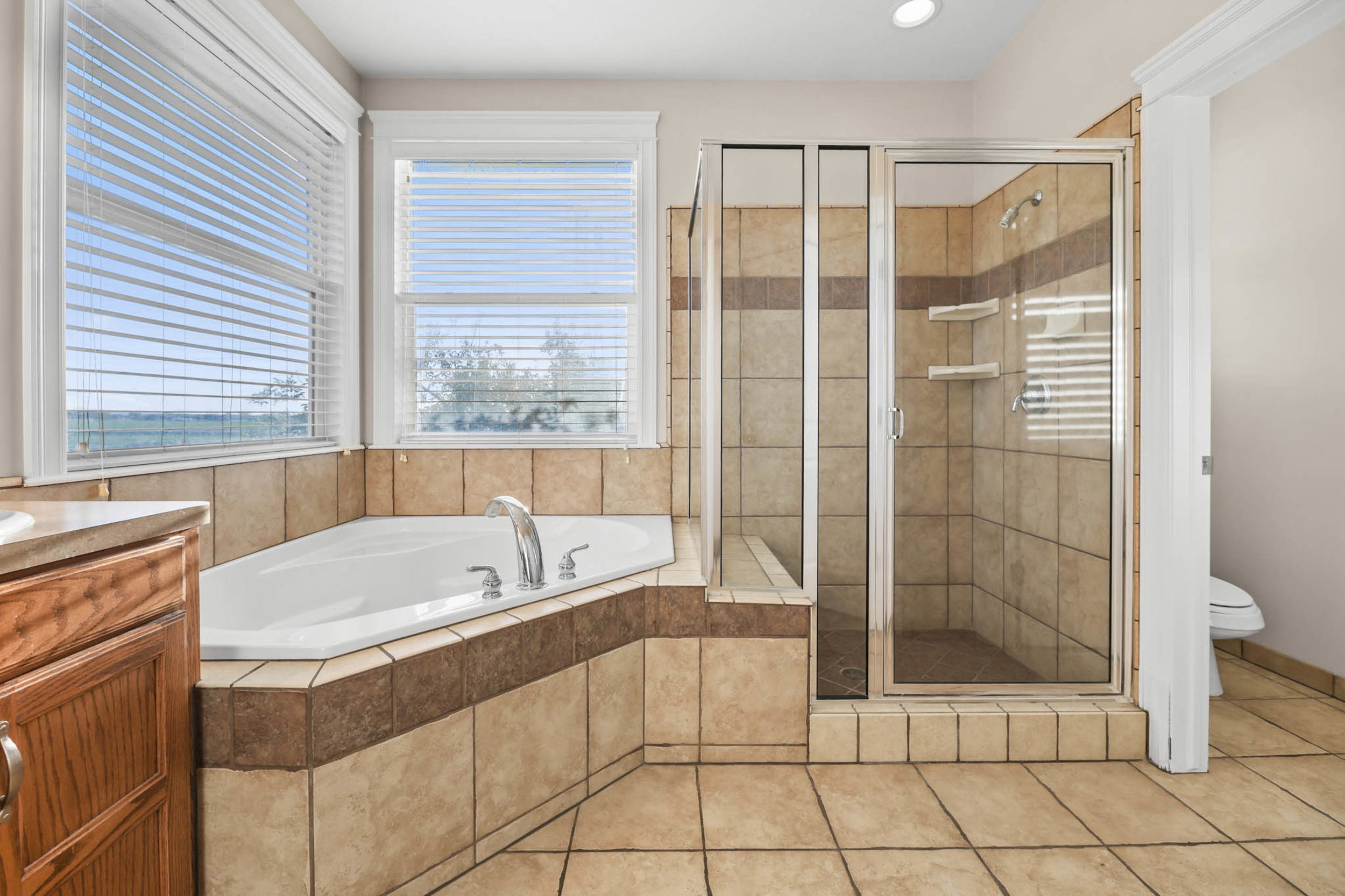 Full bathroom featuring shower, light tile patterned floors, vanity, a bath, and recessed lighting, ensuite