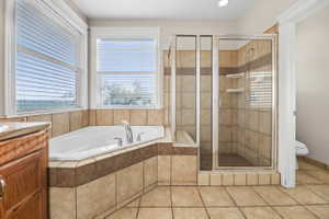 Full bathroom featuring shower, light tile patterned floors, vanity, a bath, and recessed lighting, ensuite