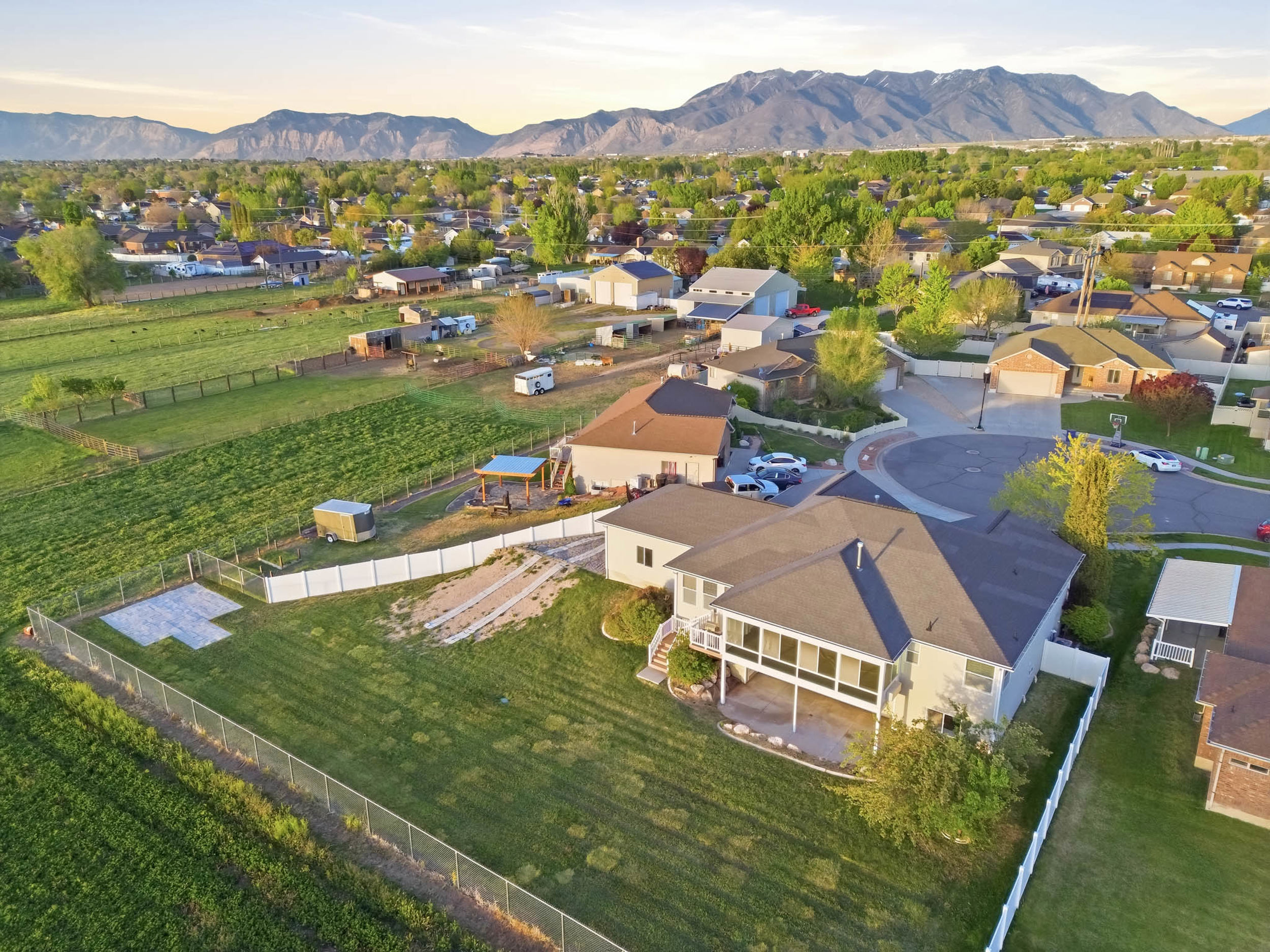 Aerial view at dusk of a residential view and a mountain view