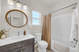 Full bathroom featuring vanity and shower / tub combo