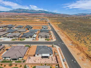 Aerial perspective of suburban area featuring a mountainous background