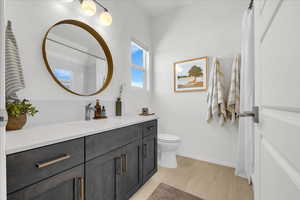 Bathroom featuring vanity and a shower with shower curtain