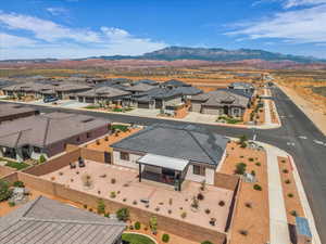 Aerial perspective of suburban area featuring a mountain backdrop