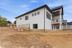 View of home's exterior with a balcony
