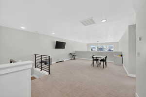 Game room featuring light colored carpet and recessed lighting