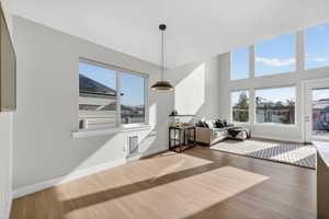 Living area featuring wood finished floors and baseboards