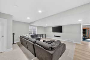Living room with baseboards and recessed lighting