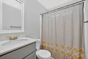 Full bath featuring vanity and a shower with shower curtain