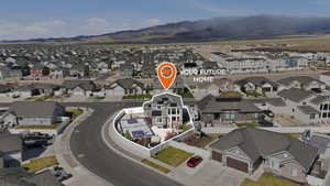Aerial view of residential area featuring mountains