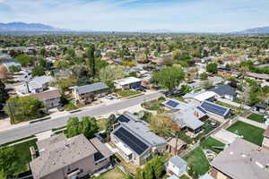 Aerial view of residential area featuring a mountainous background
