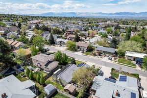 Aerial perspective of suburban area with a mountain backdrop