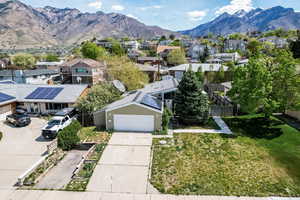 Aerial perspective of suburban area featuring a mountain backdrop