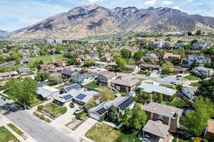 Aerial perspective of suburban area featuring a mountainous background