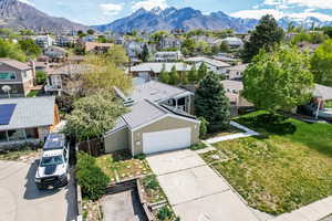 Aerial perspective of suburban area featuring a mountainous background